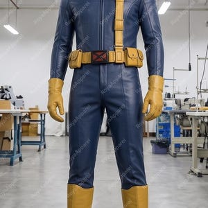 May include: A full-body blue jumpsuit costume featuring a high collar and front zip. It includes a yellow utility belt with pouches, a yellow shoulder strap with a circular red and black X-logo emblem, yellow gloves, and yellow knee-high boots.