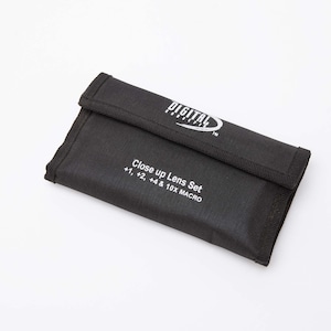 May include: A black nylon carrying case for a close-up lens set. The case is rectangular with a fold-over flap. White text on the case reads "DIGITAL" and "Close up Lens Set +1, +2, +4 & 10X MACRO".