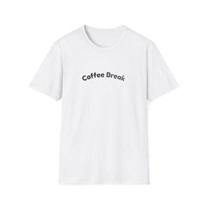 May include: A white short-sleeved t-shirt featuring the text "Coffee Break" printed in a dark gray, slightly arched font across the center of the chest. The garment has a classic crew neckline and a standard fit, presented against a plain background.