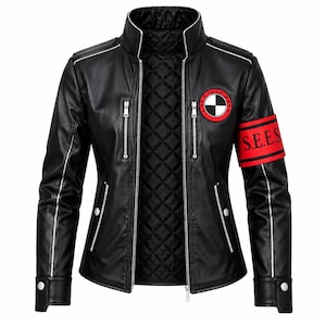 May include: A black jacket with a high collar, silver zippers, and a quilted interior lining. The left chest features a circular patch with a black and white checkered pattern. A red armband with the black text S.E.E.S. is on the left sleeve.