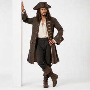 May include: A dark brown long coat with decorative gold-toned buttons and horizontal trim, worn over a cream-colored shirt and dark trousers. The outfit includes a matching dark brown tricorn hat and tall brown leather boots with folded cuffs.