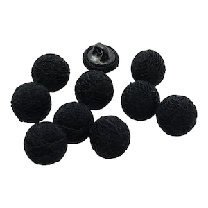 May include: A group of ten black lace covered buttons with a black metal shank. The buttons are round and have a delicate lace pattern.