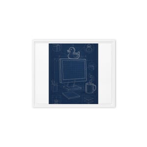 May include: A framed wall art print featuring a dark blue technical blueprint design. The illustration displays a computer monitor with a rubber duck on top, a coffee mug, a pencil holder, and a notebook, all rendered in white line art.