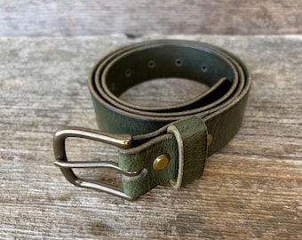 Green leather belt with solid brass buckle. Polished, antiqued or nickel.