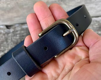 Black leather belt with solid brass buckle. Polished, antiqued or nickel.