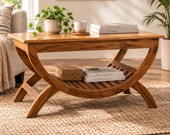 Mesa de centro rectangular de madera con patas curvas y estante inferior de listones.