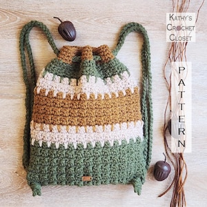 May include: A handmade crochet backpack in shades of green, tan, and cream. The drawstring bag features a striped pattern and long green straps. The text "Kathy's Crochet Closet" and "PATTERN" are visible in the image.