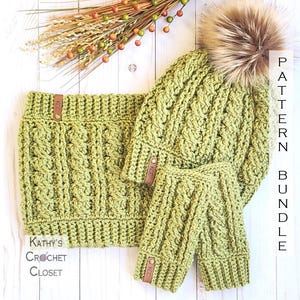 May include: A green crochet hat, scarf, and fingerless gloves set with a faux fur pom pom on the hat. The set is made with a cable stitch pattern and has brown leather labels with the text "KCC" on them. The text "PATTERN BUNDLE" is written vertically on the right side of the image.