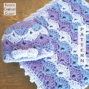 May include: A crocheted baby blanket and matching hat in shades of lavender, light blue, and white. The blanket has a scalloped edge and a repeating pattern of squares. The hat is a simple beanie style. The text "PATTERN" is visible on the right side of the image.