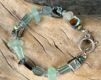 Genuine sea glass  bracelet. With abalone and fluorite. The sea glass is never altered.