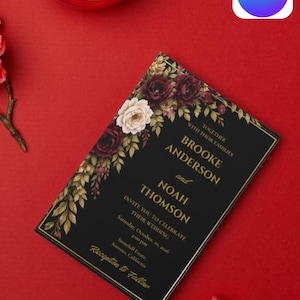 May include: A rectangular wedding invitation card with a black background, gold border, and floral accents in deep red and cream. The text reads: Together with their families Brooke Anderson and Noah Thomson invite you to celebrate their wedding.
