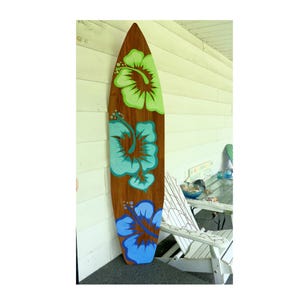 One Handpainted 6 Foot Wood Hawaiian Surfboard Wall Art Decor with three large hibiscus flowers design