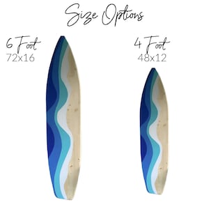 Large 6 foot wood surfboard wall art with abstract waves that look like the beach, ocean and sky.