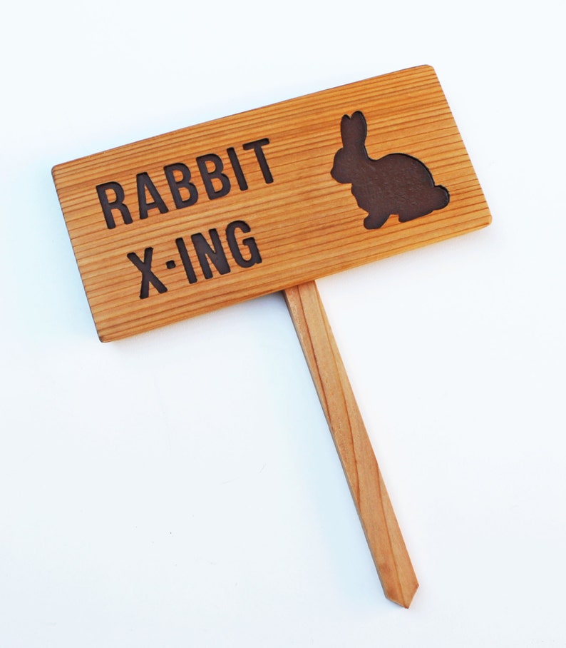 Rabbits sing. Outdoor sign.