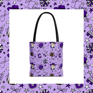 May include: A tote bag with a light purple background featuring a repeating pattern of football-themed icons including helmets, pom-poms, footballs, stars, bows, the letter C, and the text Colonels and Touchdown in purple, white, and grey.