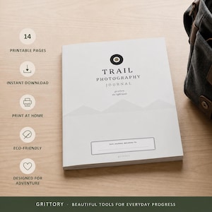 May include: A white Trail Photography Journal with a black circular logo, mountain graphic, and the text 'go where the light leads'. The cover includes a field for ownership information and the brand name Grittory at the bottom center.