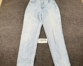 May include: Light blue denim jeans featuring a high-waisted fit, a button and zipper fly closure, and classic five-pocket styling. A small white rectangular tag with the black printed number 12376 is placed on the front of the jeans.