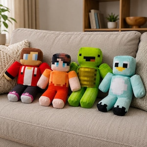 May include: Four plush toys with blocky, pixelated designs. The first is a character in a red jacket, the second wears an orange shirt, the third is a green turtle-like creature, and the fourth is a light blue bird-like figure with black feet.
