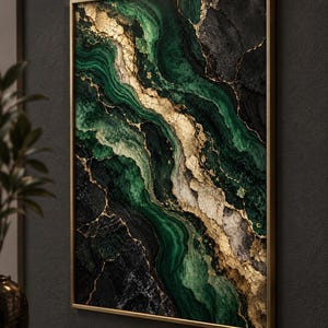 May include: A rectangular wall art piece in a thin gold frame featuring an abstract marble pattern with deep emerald green, charcoal black, and white swirls accented by textured metallic gold veins, illuminated by a gold light fixture above.