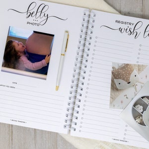 May include: A white and black pregnancy journal with a photo of a pregnant woman and a child. The journal has a section for "belly photo" and a section for "registry wish list".