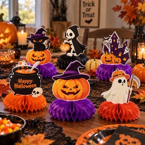May include: A set of six Halloween honeycomb centrepieces featuring a black cat on a pumpkin, a skeleton, a haunted house, a cauldron with the text Happy Halloween, a jack-o'-lantern, and a ghost holding a scythe, all on colourful paper bases.
