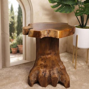 May include: A brown wooden side table crafted from a single tree stump, featuring a smooth, flat circular top with a natural, irregular edge and a thick, textured base that flares outward at the bottom, showcasing visible wood grain and knots.