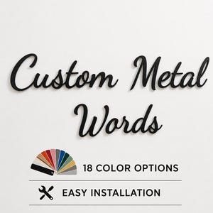 May include: Black metal wall lettering in a cursive script font that reads Custom Metal Words. Below the text is a fan-shaped color swatch showing 18 color options, followed by the text 18 COLOR OPTIONS and EASY INSTALLATION with a wrench icon.