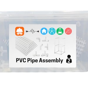 May include: A clear plastic storage bin containing a PVC pipe assembly kit. The label features the text PVC Pipe Assembly, a number 2 icon, and various small graphics including a hard hat, electrical plug, house, beaker, and geometric tools.