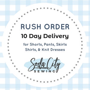 May include: A white circle with a gray dotted border on a blue and white gingham background. The text "RUSH ORDER 10 Day Delivery for Shorts, Pants, Skirts Shirts, & Knit Dresses" is in black text. The text "Soda City SEWING" is in black text with a blue watercolor background.