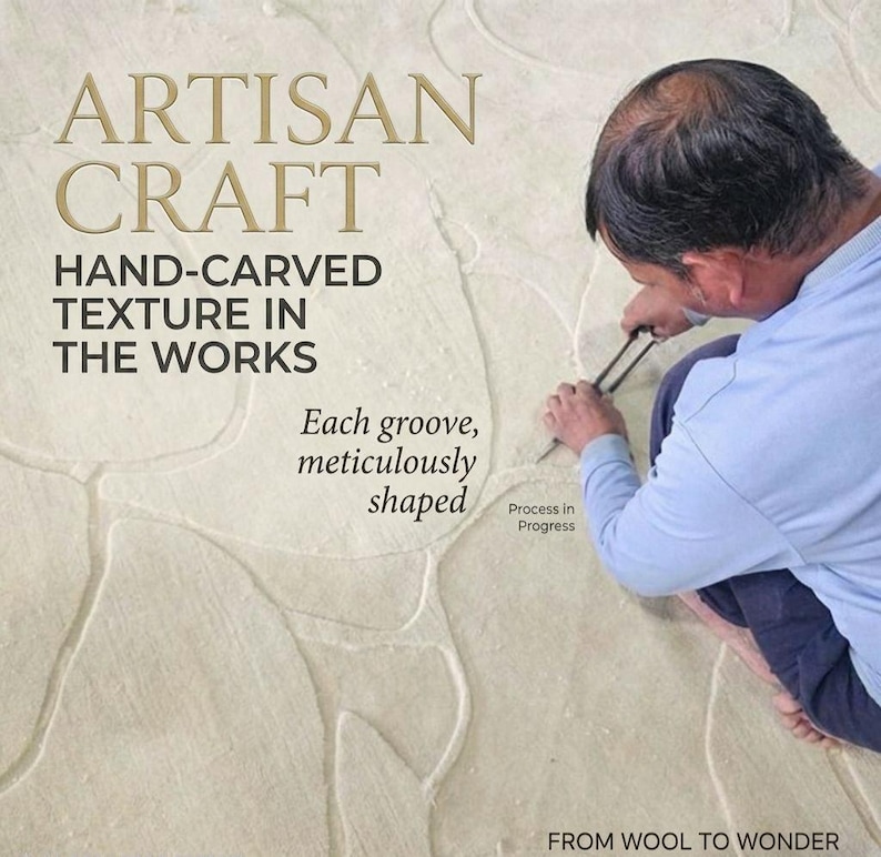 May include: A light-colored textile surface featuring hand-carved grooves. Text reads: ARTISAN CRAFT, HAND-CARVED TEXTURE IN THE WORKS, Each groove, meticulously shaped, Process in Progress, FROM WOOL TO WONDER. A tool is used to shape the material.