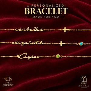 May include: Three gold-toned chain bracelets featuring personalized cursive names Isabella, Elizabeth, and Kaylee. The bracelets include small gold cross charms and round bezel-set gemstones in blue and green. Text reads A PERSONALIZED BRACELET MADE FOR YOU.