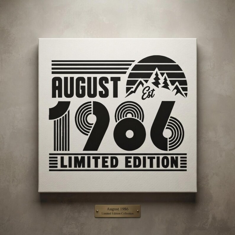 May include: A square canvas print featuring black text and graphics on a white background. The design includes the words AUGUST EST 1986 LIMITED EDITION, a mountain silhouette, and a sun graphic. A small gold plaque below reads August 1986 Limited Edition Collection.