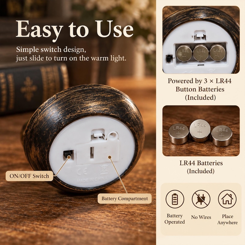 May include: A round, dark bronze-colored object with a white plastic base featuring an ON/OFF switch and a battery compartment. It is powered by three LR44 button batteries. The text reads Easy to Use, Simple switch design, just slide to turn on the warm light, Powered by 3 x LR44 Button Batteries, LR44 Batteries, Battery Operated, No Wires, and Place Anywhere.