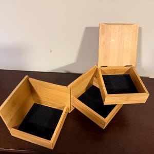 May include: A rustic wooden sign with the text "Welcome to our home" in white lettering. The sign features a distressed finish and a simple, inviting design, perfect for entryway decor.