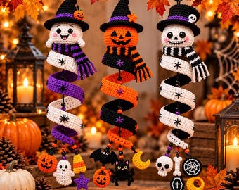 May include: Three hanging crochet spiral ornaments featuring a ghost, a jack-o'-lantern, and a skull, each wearing a hat and scarf. The spirals are decorated with small charms including pumpkins, bats, cats, moons, skulls, and spiderwebs.
