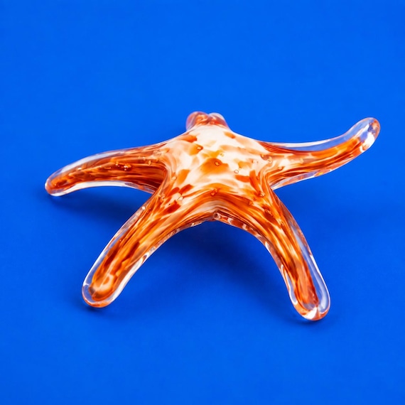 Individually mouth-blown glass starfish with genuine coastal sculptural presence — not a mass-cast resin knockoff.
