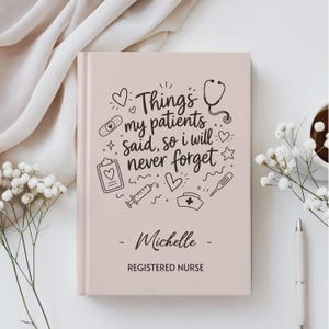 May include: A light pink hardcover journal featuring black text that reads Things my patients said, so i will never forget, Michelle, and REGISTERED NURSE, surrounded by medical icons including a stethoscope, syringe, and heart.
