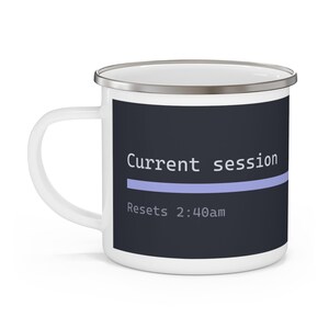 May include: A white enamel mug featuring a dark grey rectangular graphic on the front. The design includes the white text "Current session" above a light purple horizontal line, with the white text "Resets 2:40am" positioned below the line.