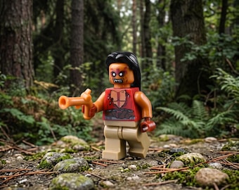 May include: A Lego minifigure with long black hair, a red torso featuring a skeletal rib cage print, and tan legs. The figure has a distressed face with dark eye markings and holds a small orange plastic musket in its right hand.