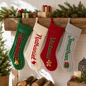 May include: Four cable-knit Christmas stockings in green, cream, red, and grey. Each stocking features a ribbed cuff and is personalized with embroidered names: Elizabeth, Nathaniel, Victoria, and Jonathan, accented with small felt holiday icons.