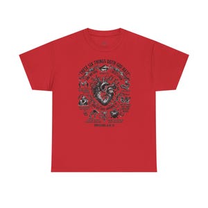 May include: A red short-sleeve t-shirt featuring a central anatomical heart illustration surrounded by six small vignettes and text that reads: THESE SIX THINGS DOTH GOD HATE, AND HIS SOUL ABHORRETH, PROVERBS 6:16-19, along with descriptive labels.