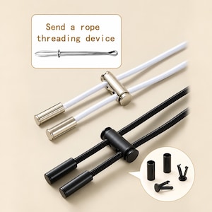 May include: Two sets of drawstring cord locks with matching aglets, one in silver and one in black. Includes a metal rope threading device and small black plastic components shown in circular insets. The cords are white and black respectively.