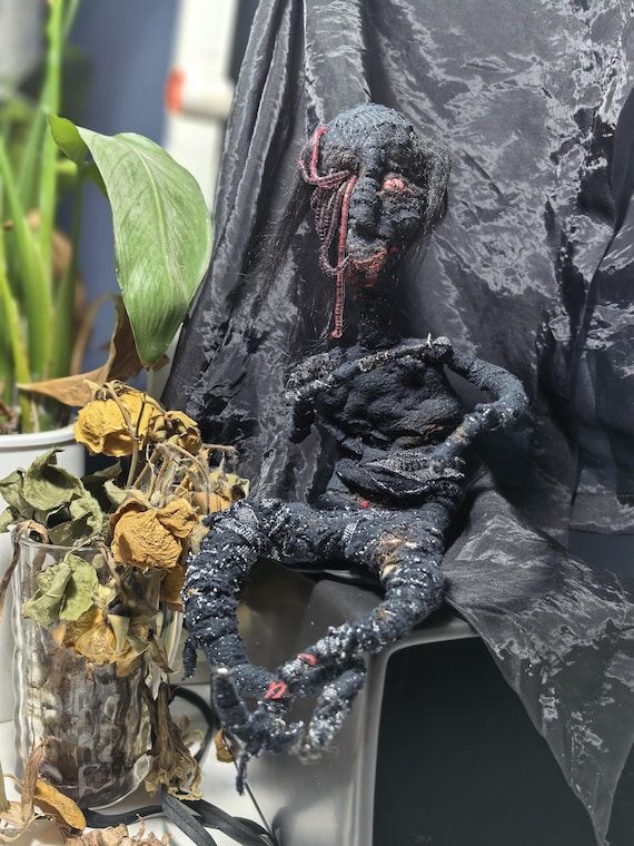 A one-of-a-kind handmade horror art doll that's equal parts unsettling and impressive — the kind of piece that stops guests dead in their tracks.