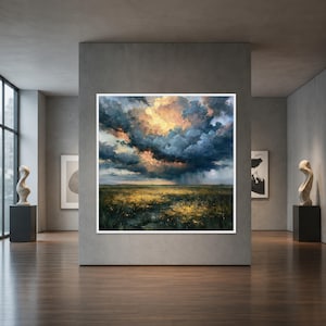 May include: A square framed wall art piece depicting a landscape with a vast field of yellow wildflowers under a dramatic, dark, and stormy sky with golden light breaking through the heavy clouds, displayed on a gray gallery wall.