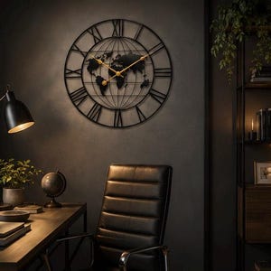 May include: A large circular wall clock featuring a black metal frame with Roman numerals and a central world map silhouette. The clock has thin gold-colored hands and a grid of longitude and latitude lines spanning the interior of the frame.