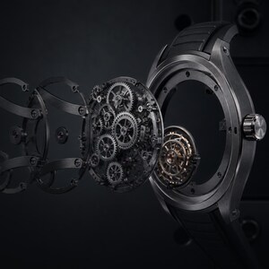 Op de afbeelding: Een zwart polshorloge met een explosietekening die de interne mechanische tandwielen en onderdelen toont. De tekst luidt: VANTO / APERTURE ONE, A calibre in motion. Embedded 5-second H.264 film with autoplay, looping, inline playback, and a custom pause control.