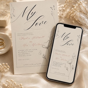 Könnte beinhalten: Eine Hochzeitseinladungskarte und ein Smartphone, das dasselbe Design anzeigt. Das cremefarbene Papier zeigt den schwarzen kursiven Schriftzug My Love, florale Strichzeichnungen sowie die Details von Sophie Hartwell und Mae Marlowe.