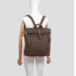 Brand new backpack in  tweed-style fabric with leather-look trim.