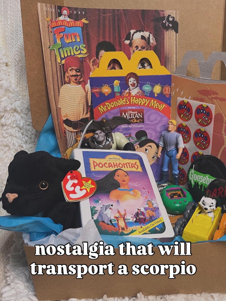 May include: A collection of 1990s memorabilia including a Fun Times magazine, a McDonald's Happy Meal box featuring Mulan, a Pocahontas VHS case, a black Ty Beanie Baby panther, a John Smith action figure, a green digital pet, and Goosebumps items.