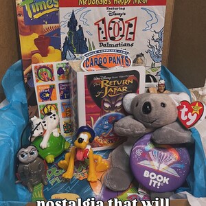 May include: A collection of vintage items including a McDonald's Happy Meal box featuring 101 Dalmatians, a VHS tape of The Return of Jafar, a Ty koala plush, a Pluto figurine, a Dalmatian toy, a Book It! button, and a Fun Times magazine issue.